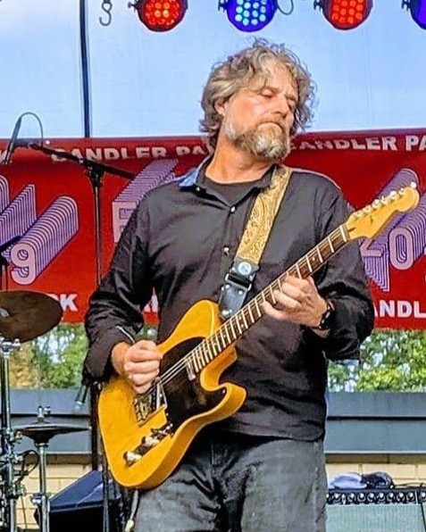 Mark Hodgdon performing live on guitar